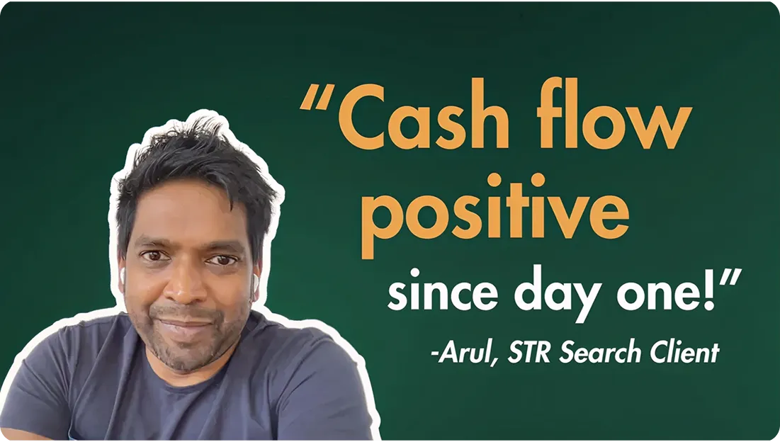 Portrait of a man with short dark hair and earbuds, alongside the quote 'Cash flow positive since day one!' attributed to Arul, STR Search Client, on a dark green background.