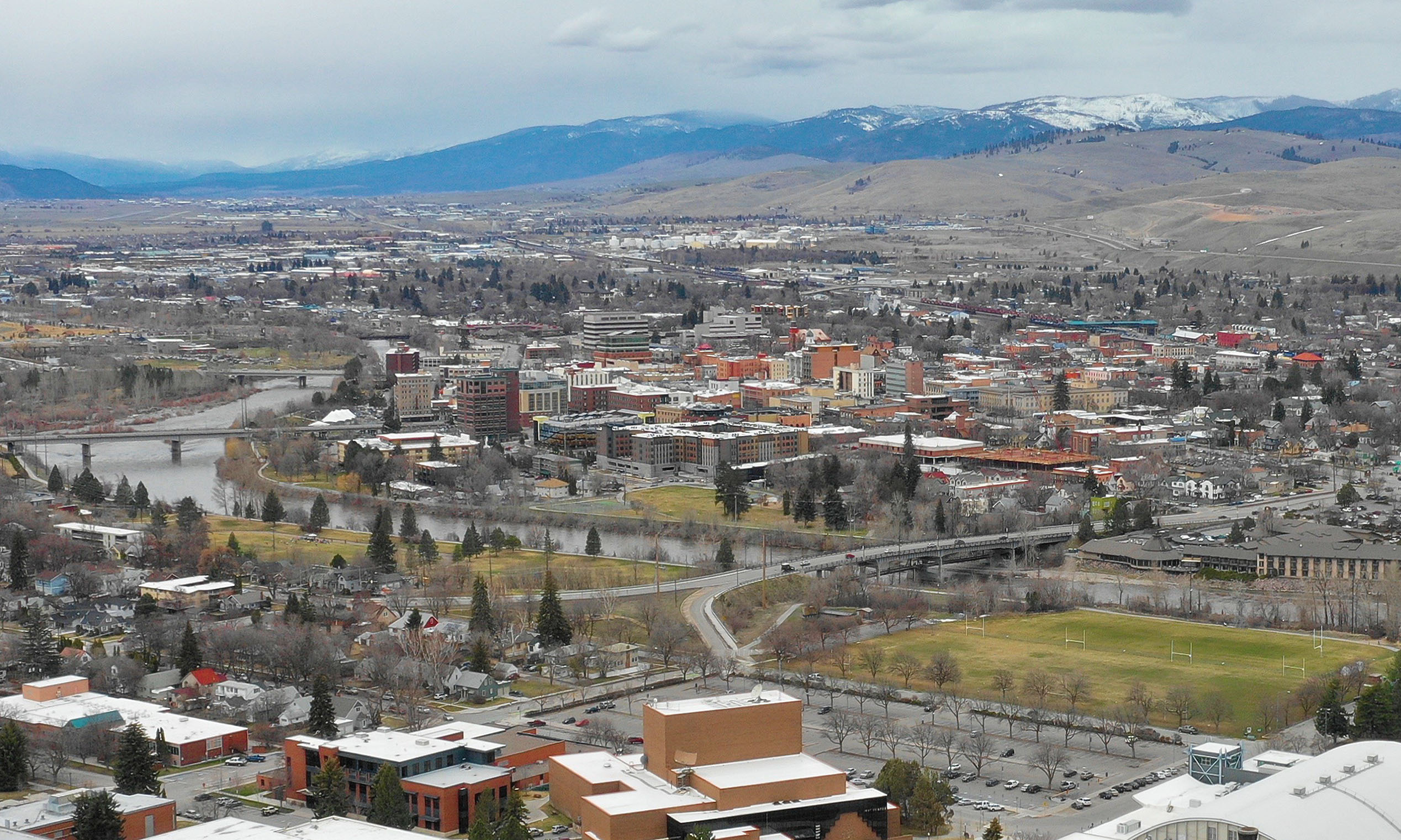 Missoula, Montana skyline and valley beneath surrounding mountains